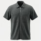 Dark gray short-sleeve shirt with a zipper on a light gray background