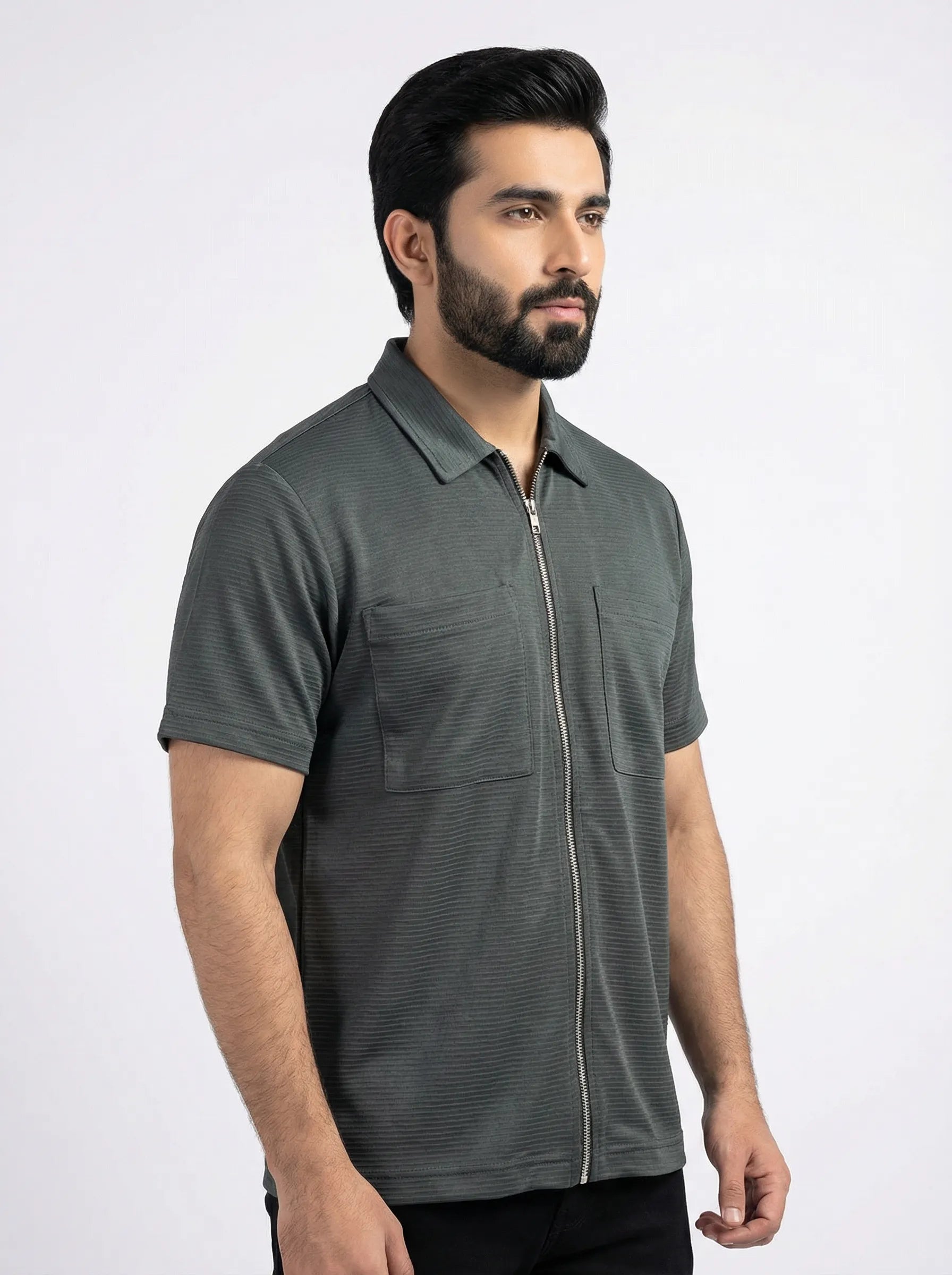 Man wearing a gray short-sleeve shirt with a collar on a white background