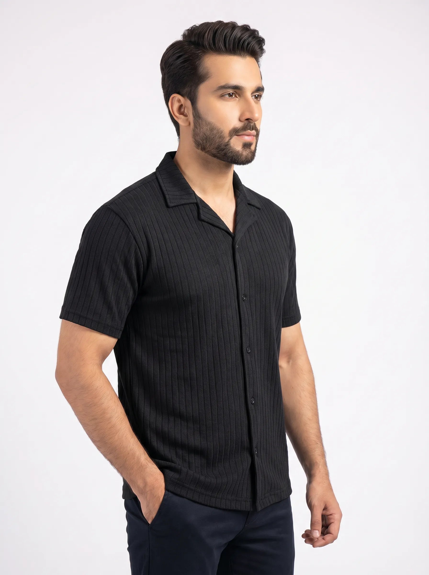 Man wearing a black short-sleeve shirt on a white background